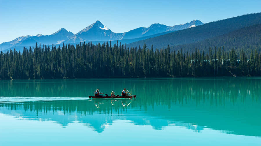 Emerald Lake Canoeing Adventure Wallpaper