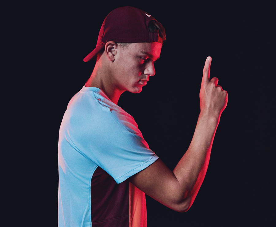 Emerging Tennis Star, Holger Rune In Action Wallpaper