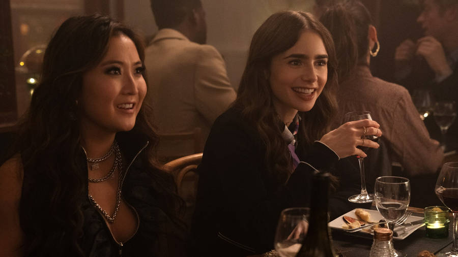 Emily Cooper (lily Collins) Enjoy A Glass Of Wine During A Night Out In Paris. Wallpaper