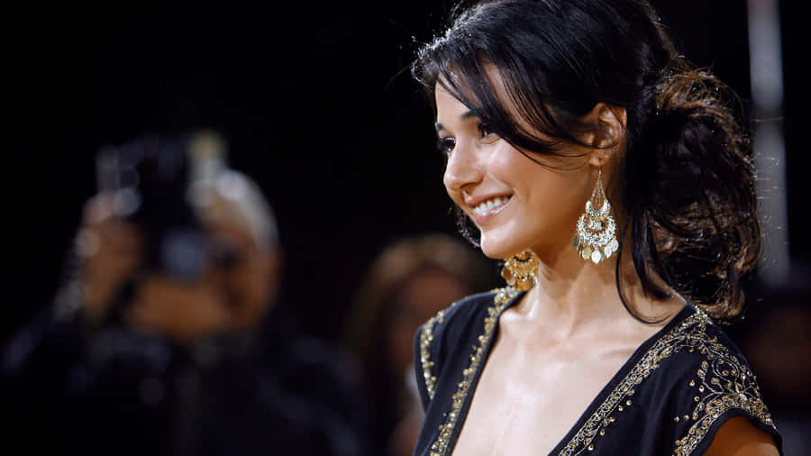 Emmanuelle Chriqui Posing For A Photoshoot Wallpaper