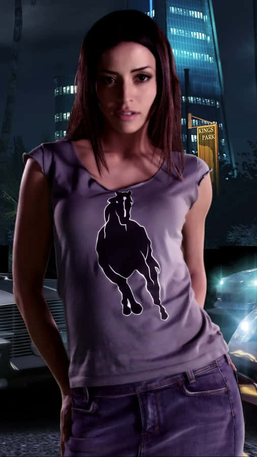 Emmanuelle Vaugier Posing Elegantly Against A Vibrant Turquoise Background Wallpaper