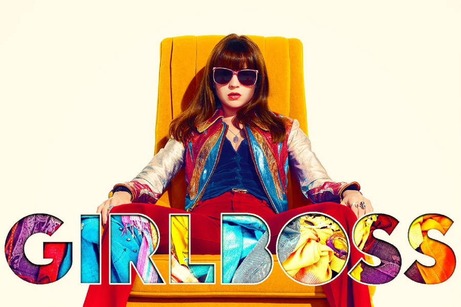 Empowered Girl Boss Relaxing On Yellow Sofa Wallpaper