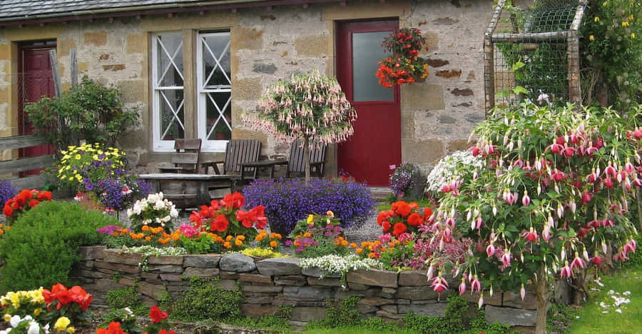 Enchanting Cottage Garden In Full Bloom Wallpaper