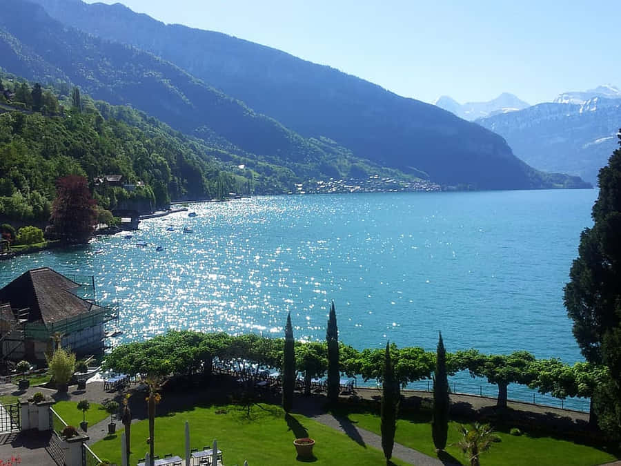 Enchanting Lakefront View Of Thun, Switzerland Wallpaper