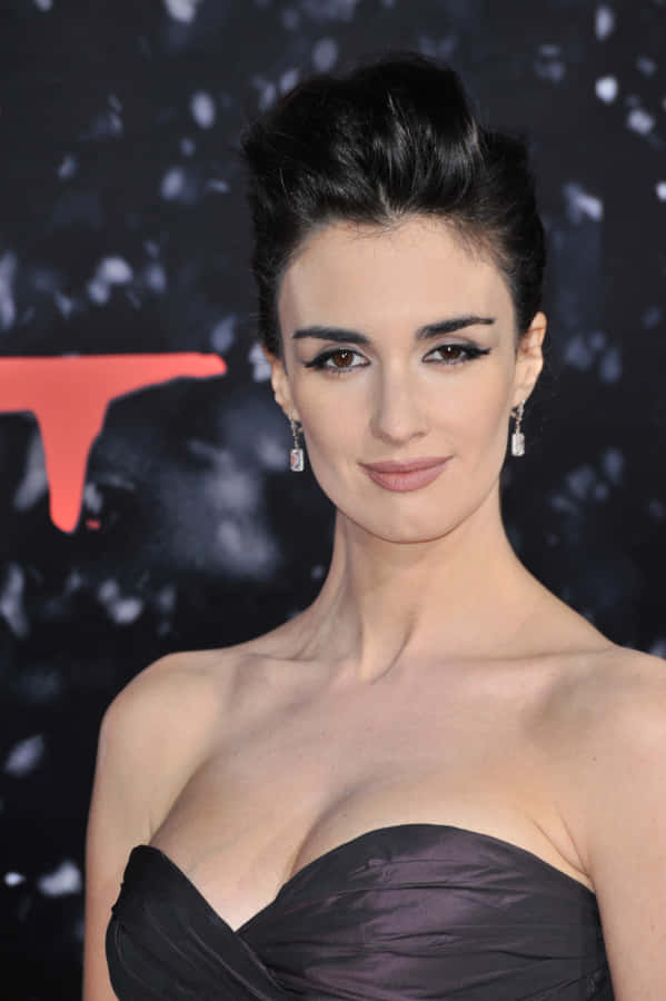 Enchanting Paz Vega Posing For A Portrait Wallpaper