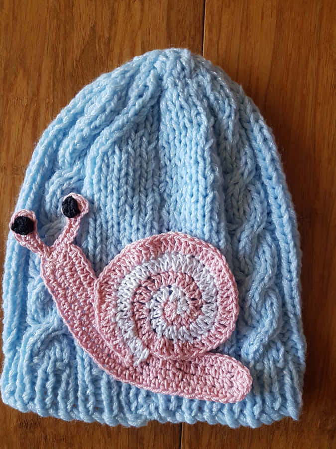 Enchanting Pink Snail On A Magical Adventure Wallpaper