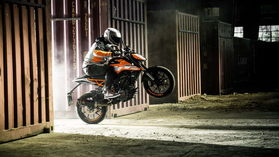 Engaging Ride With The Dynamic Ktm Sports Bike Wallpaper
