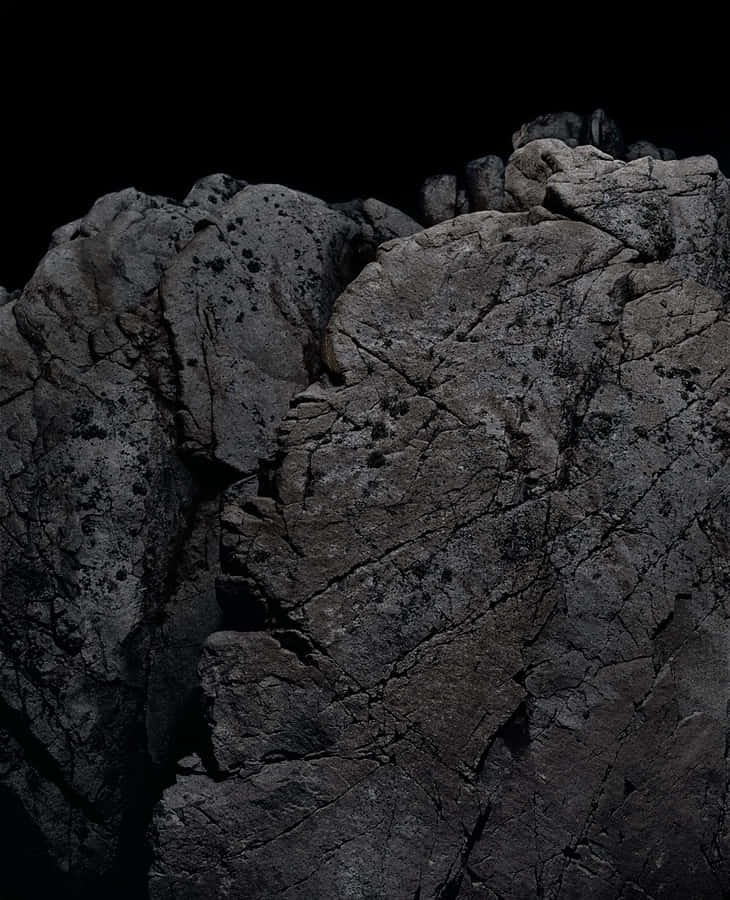 Enigmatic Dark Rock Formation Wallpaper
