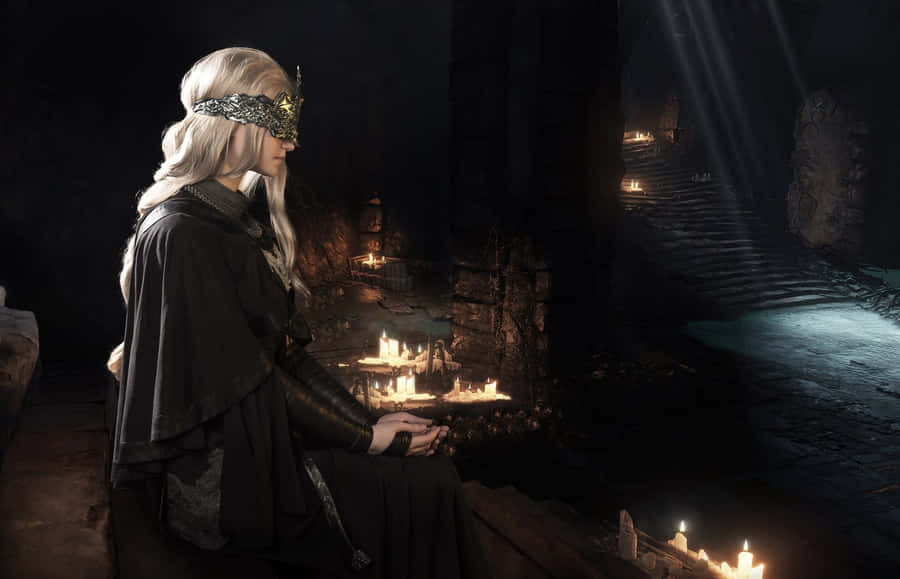 Enigmatic Fire Keeper Standing Amidst A Cold And Mystical Landscape Wallpaper