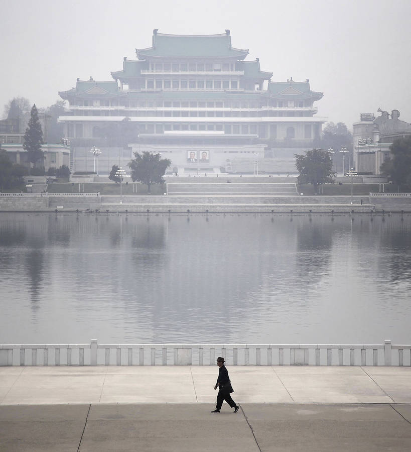 Enigmatic Foggy Morning Over Kim Il-sung Square In Pyongyang Wallpaper