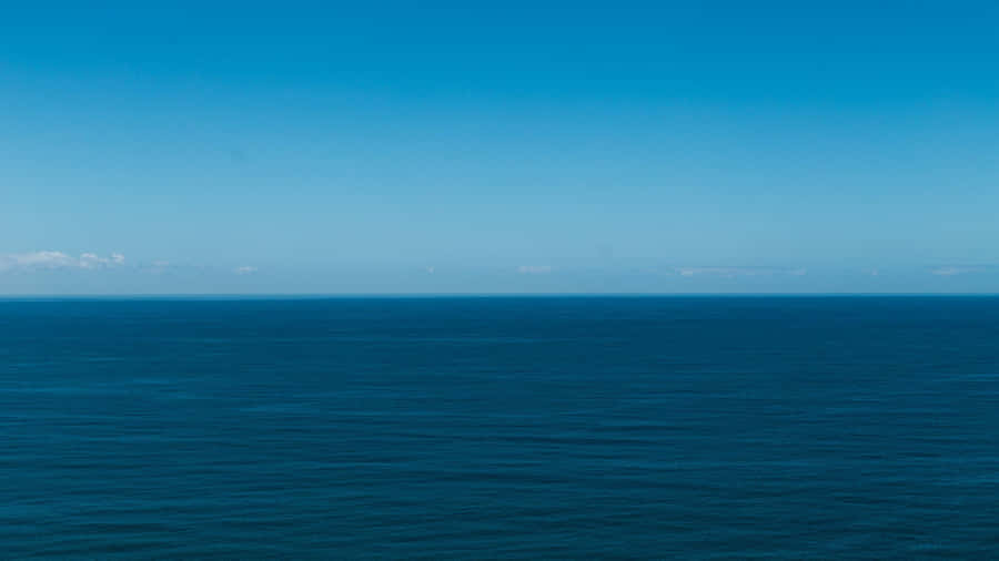Enjoy A Breathtaking View Of The Sky - Blue Horizon Wallpaper
