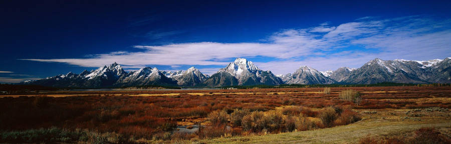 Enjoy The Beauty Of The Autumn Landscape In The Comfort Of A Dual Monitor Setup. Wallpaper