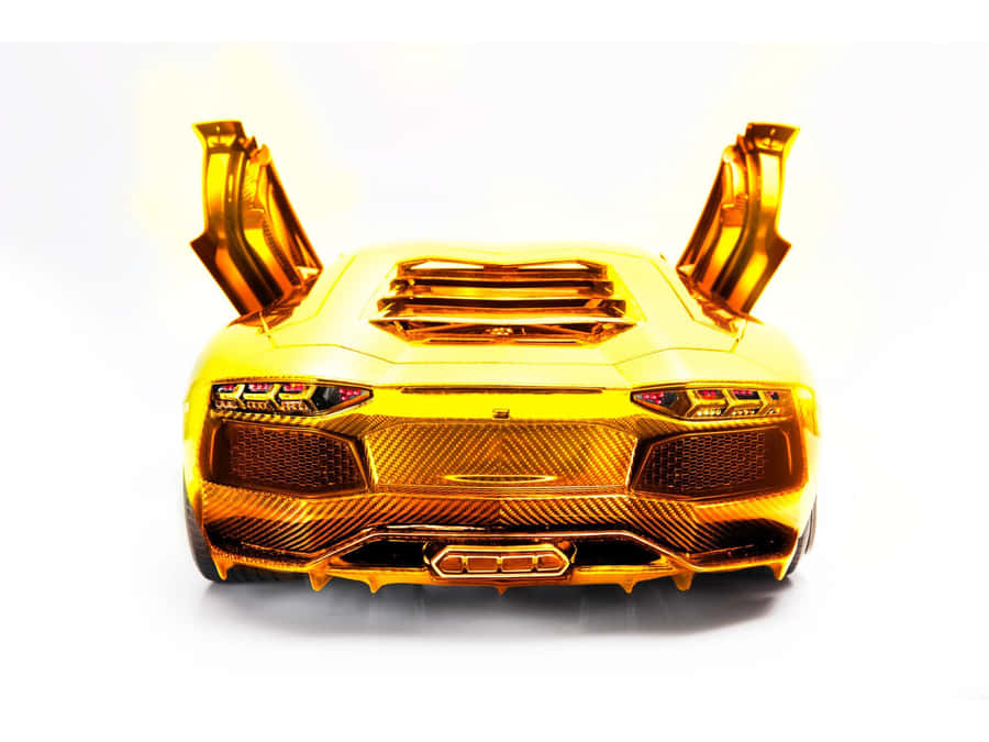 Enjoy The Luxury And Power Of A Gold Lamborghini Wallpaper