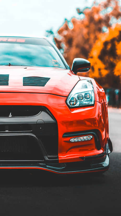 Enjoy The Power Of Speed With The Gtr Iphone. Wallpaper