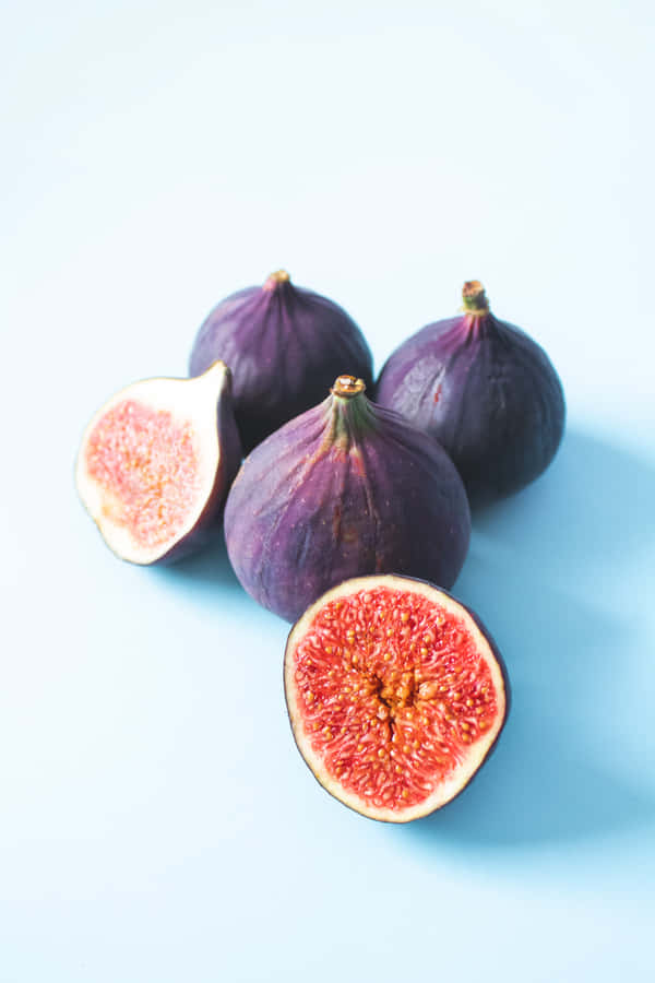 Enjoy The Surprising Sweetness Of Purple Figs Wallpaper