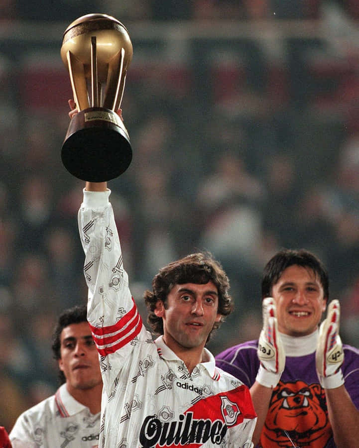 Enzo Francescoli Holding The Trophy Of Victory Wallpaper