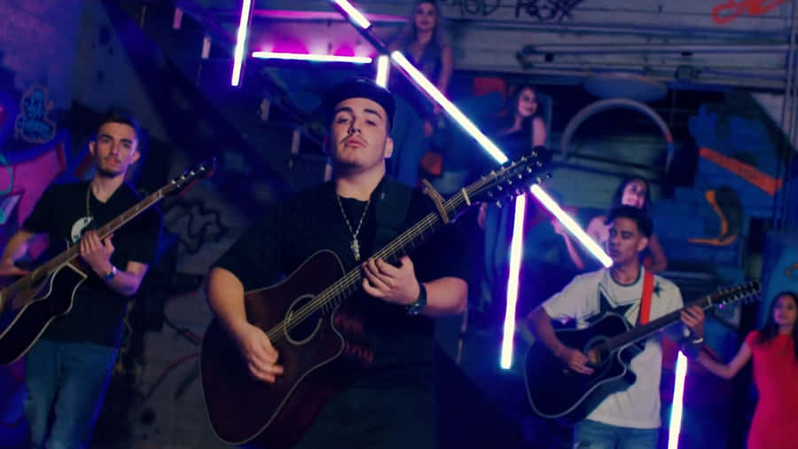 Eslabon Armado Performing Live On Stage Wallpaper