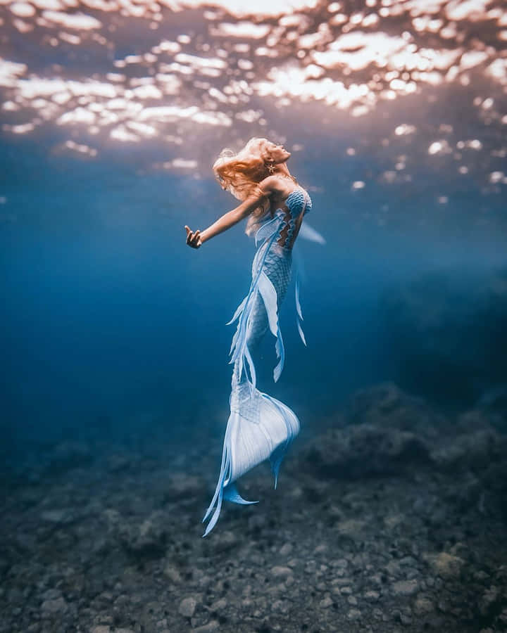 Ethereal Mermaid Underwater Photography Wallpaper
