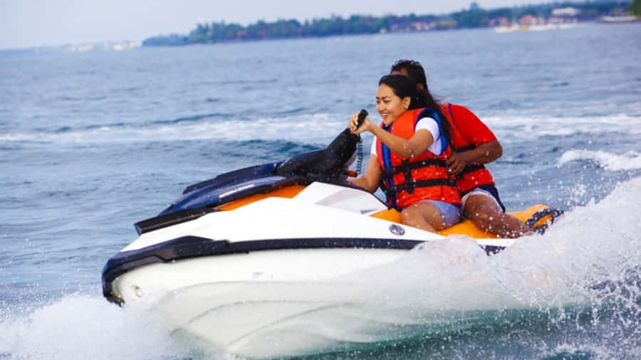 Exciting Beach Water Sports Adventure Wallpaper