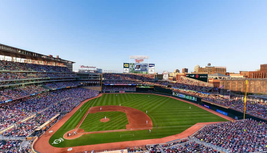 Exciting Night Game At Baseball Stadium Wallpaper