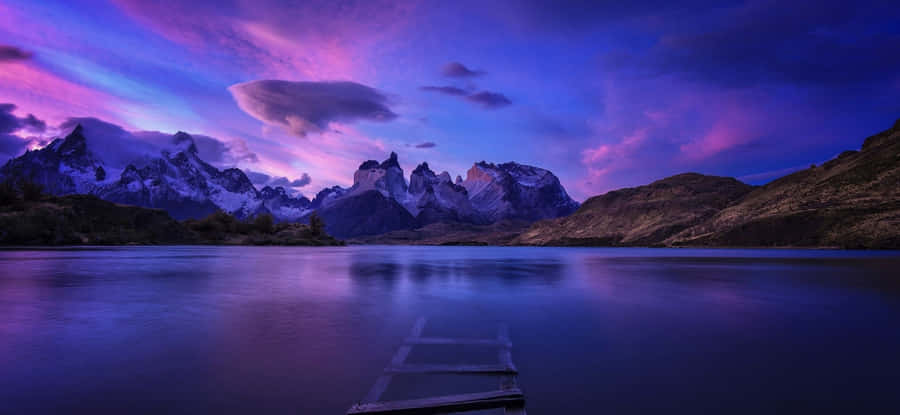 Exciting Outdoor Landscape With Green Rolling Hills And Vibrant Blue Skies Wallpaper