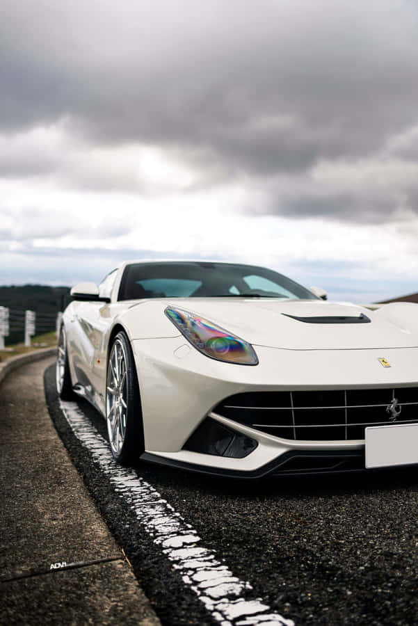 Experience Luxury With The White Ferrari Iphone Wallpaper