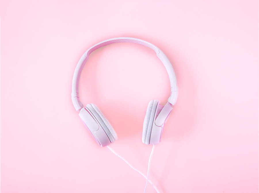 Experience The Beauty Of Music With Our Pink Headphones. Wallpaper