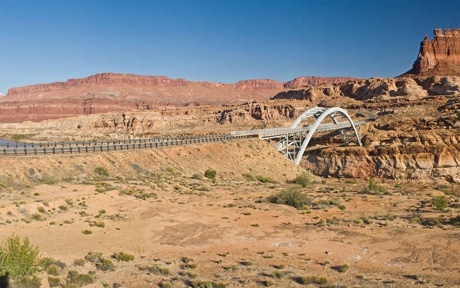 Explore The Breathtaking Desert Bridge Wallpaper