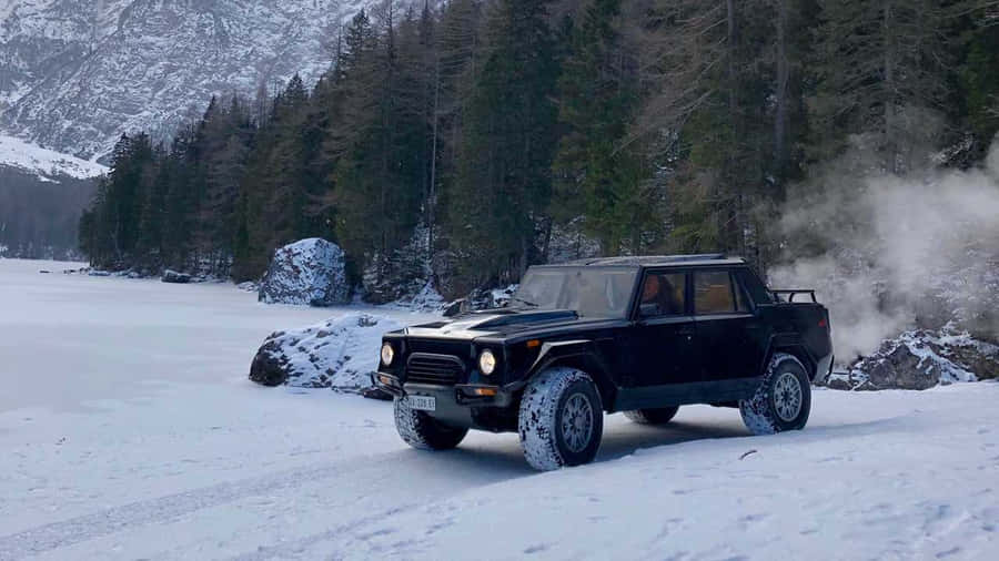 Exquisite Lamborghini Lm002 On A Scenic Mountain Road Wallpaper
