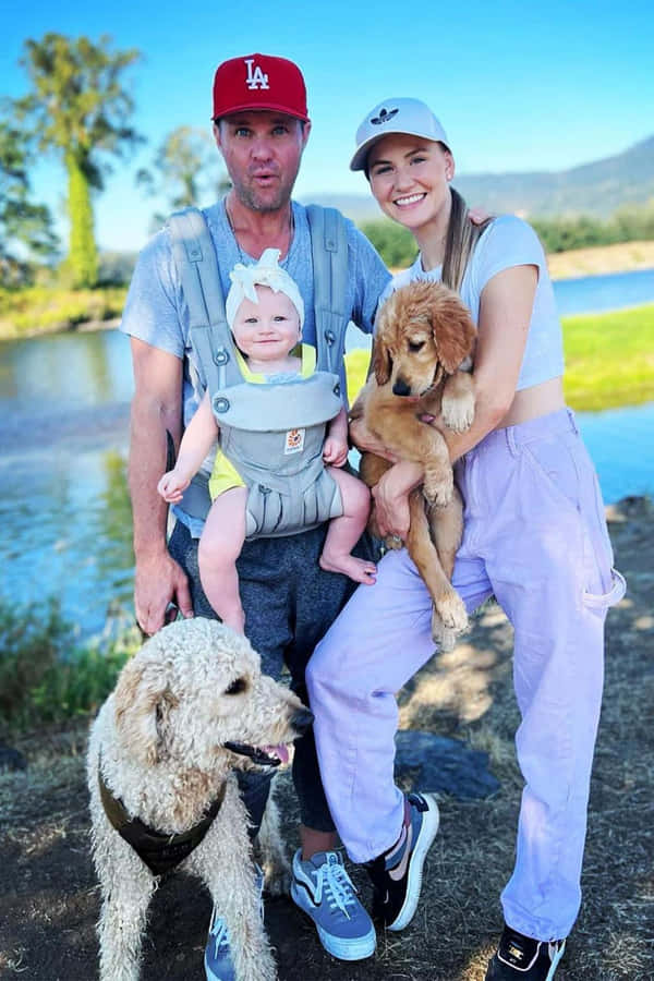 Family Outdoor Time With Pets Wallpaper