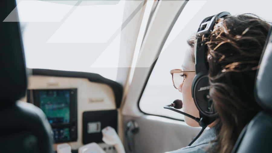 Female Pilot Navigating Wallpaper