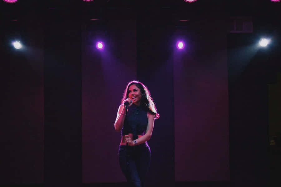 Female Singer Stage Performance Wallpaper