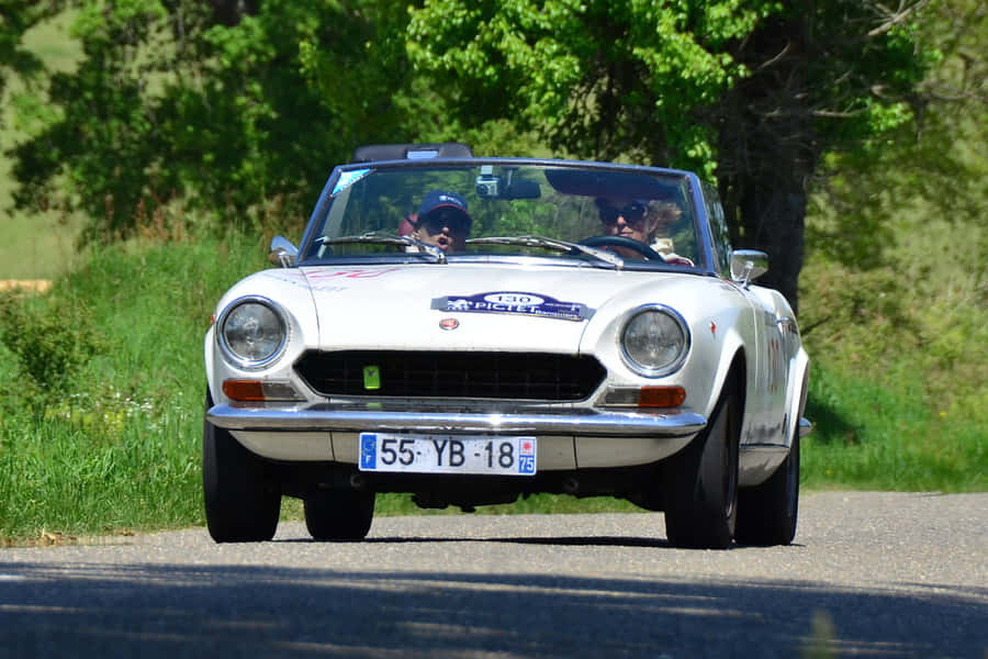 Fiat 124 Spider 2020 - Red Convertible Sports Car Parked In Scenic Landscape Wallpaper