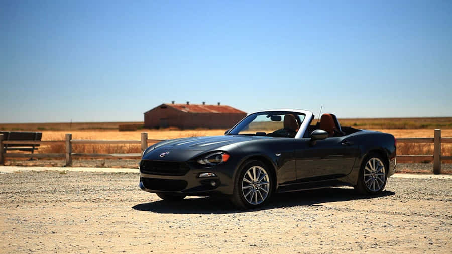 Fiat 124 Spider On The Open Road Wallpaper