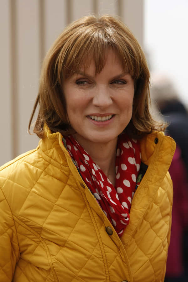 Fiona Bruce Posing Elegantly In A Stunning Red Dress Wallpaper