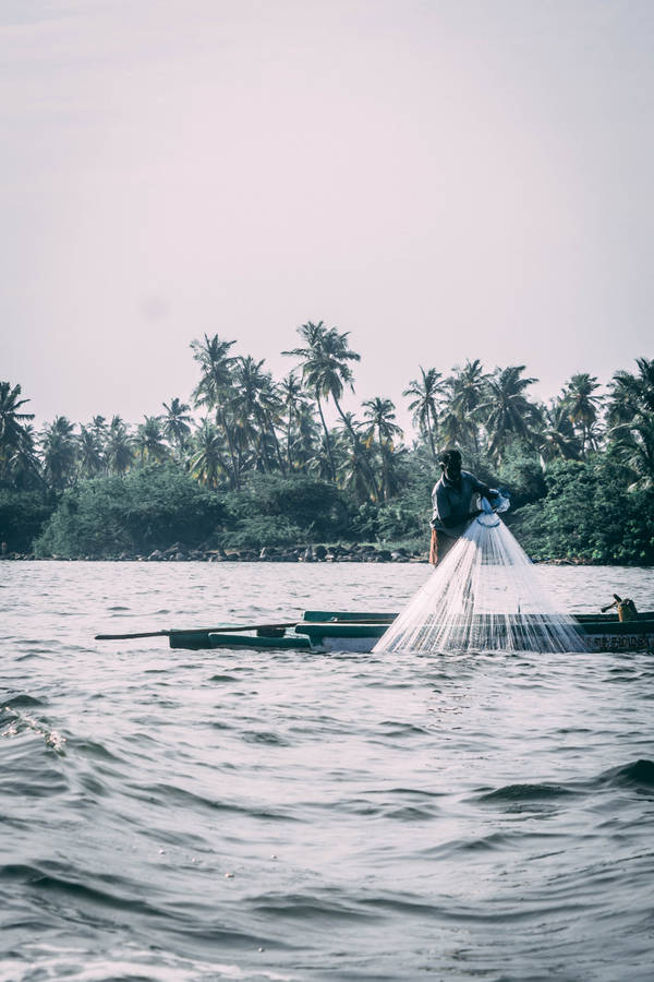 Fishing Boat In Rough Water Wallpaper