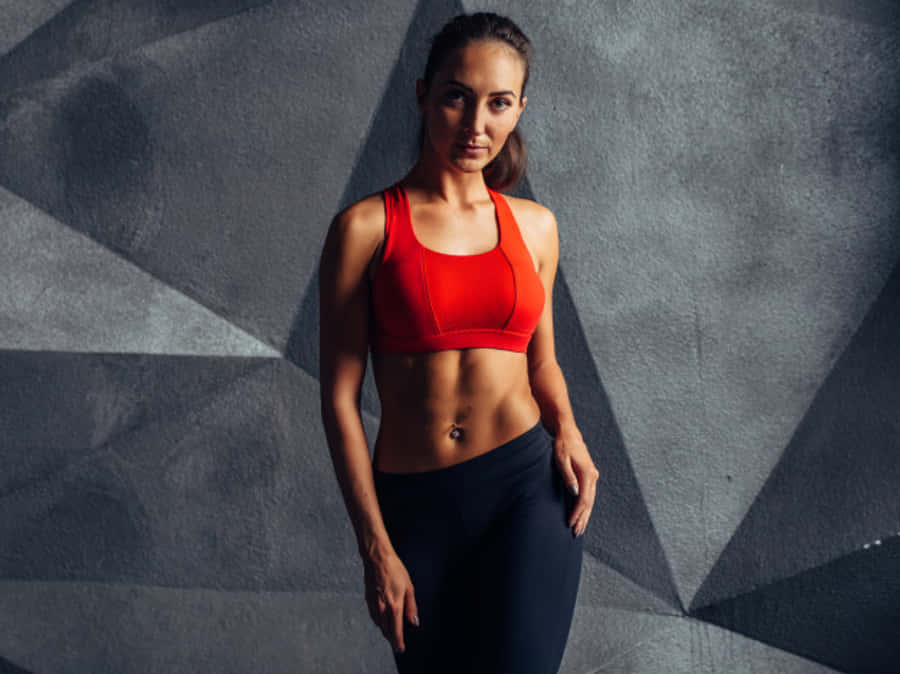 Fit Female Body Athletic Attire Wallpaper