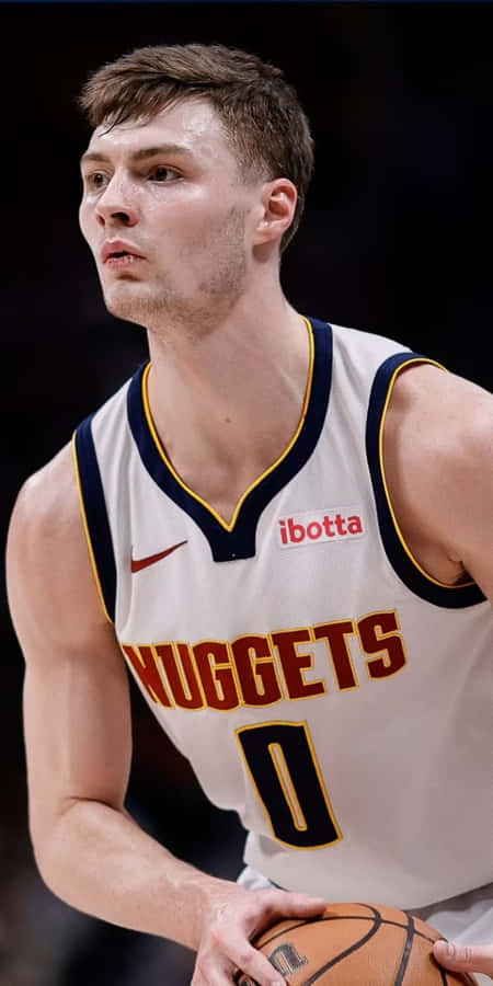 Focused Basketball Player Nuggets Uniform Wallpaper