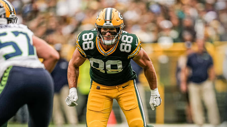 Focused Football Player Intensity Wallpaper