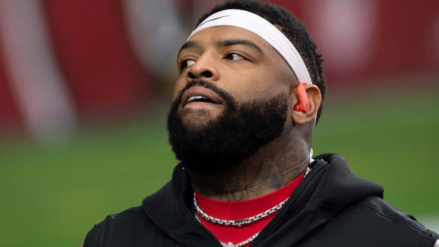 Focused Football Player Looking Upward Wallpaper