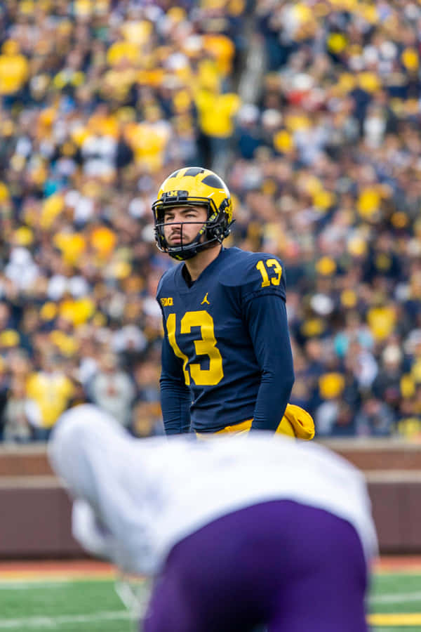 Focused Football Player Number13 Wallpaper