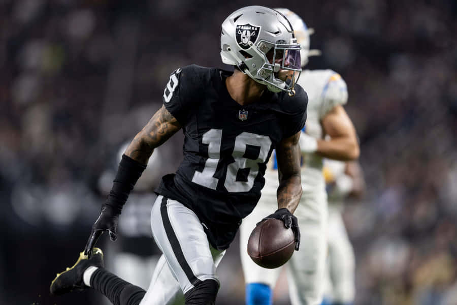 Focused Football Player Number18 Wallpaper