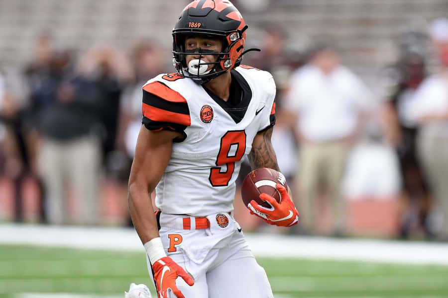 Focused Football Player Number9 Wallpaper