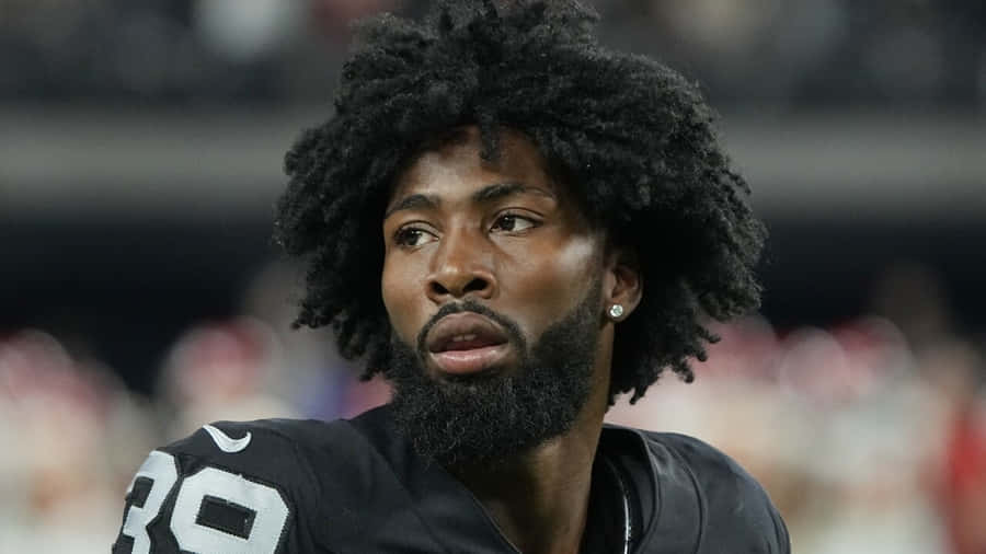 Focused Football Player Portrait Wallpaper