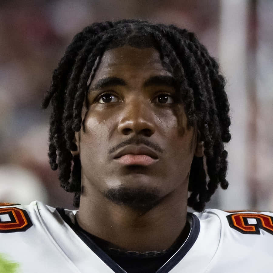 Focused Football Player Portrait Wallpaper