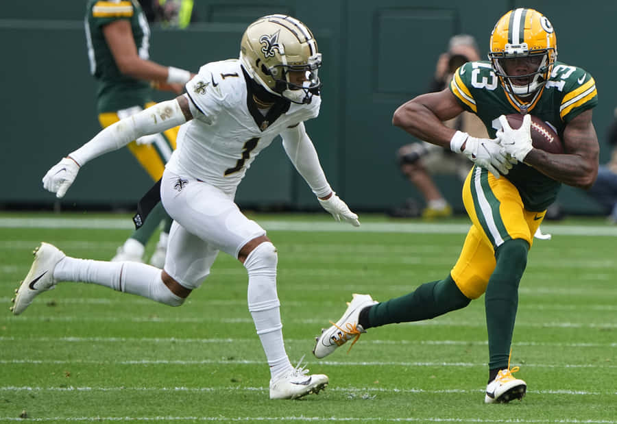 Football Action Catch Greenand White Uniforms Wallpaper