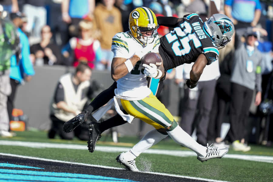 Football Action Catchand Tackle Wallpaper