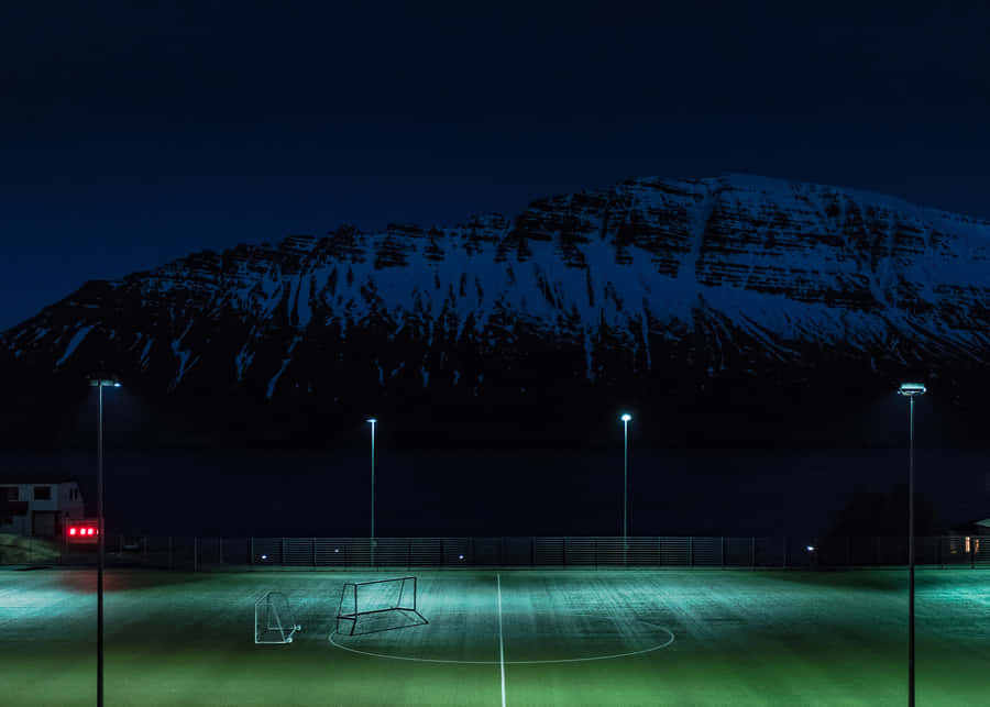 Football Field During Night Time Wallpaper