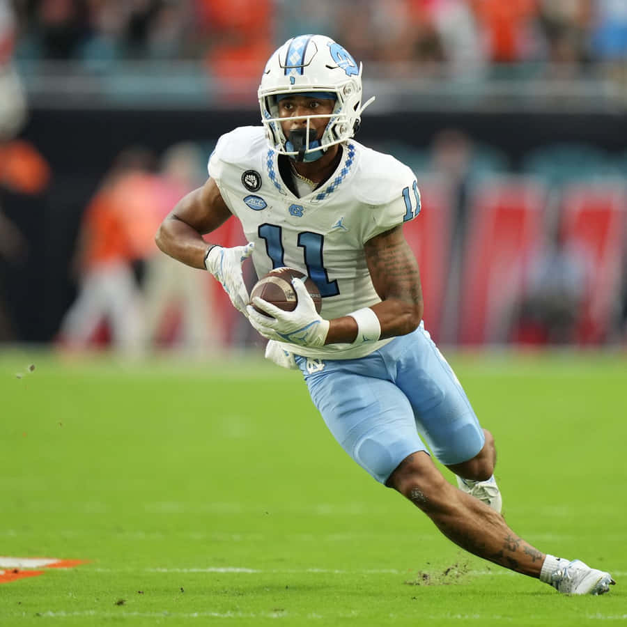 Football Player Action Shot Wallpaper