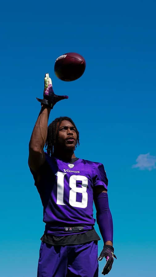 Football Player Balancing Ball Wallpaper